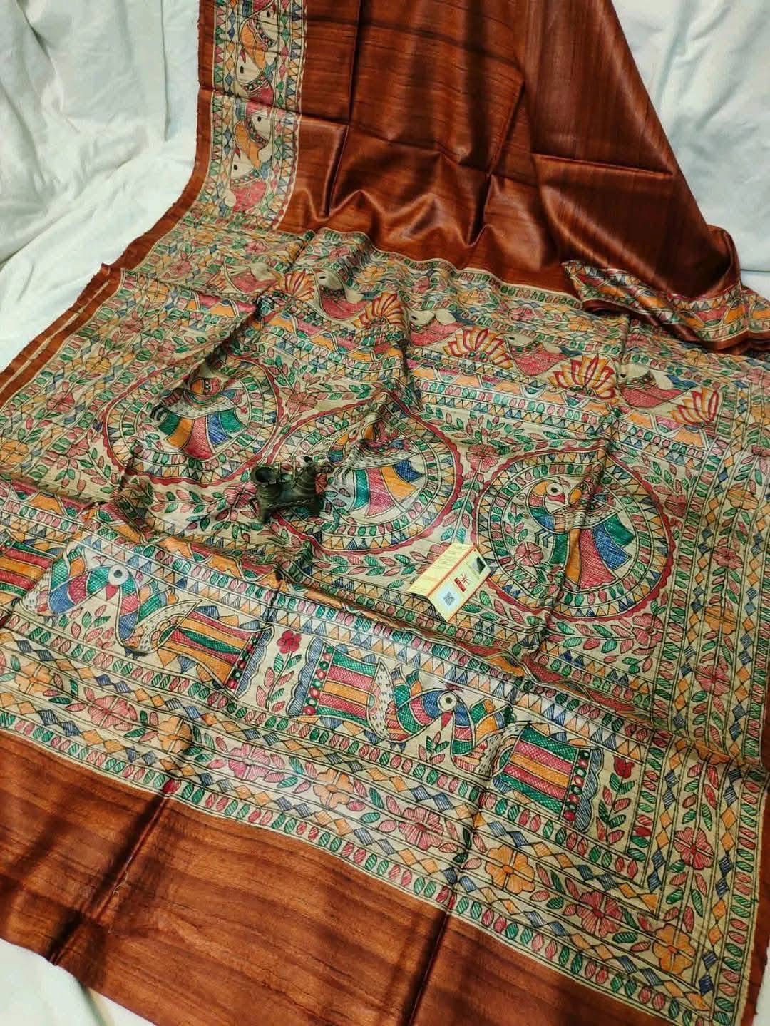 Handloom Pure Tussar Ghicha Silk Saree featuring handpainted Madhubani art on the anchal and border